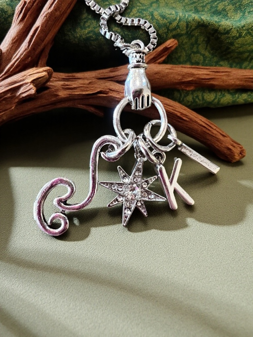 Monk DND necklace with the wind, a star, and KI Dungeons and Dragons jewelry